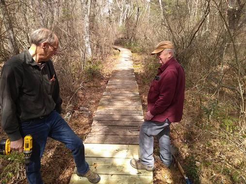 thom and roger work on boardwalk