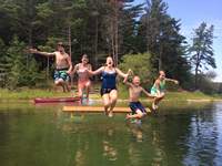 Kids jumping into pond in Myles Standish State Forest